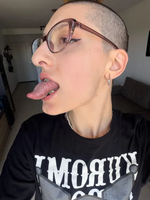 Side profile of my long tongue out, ready to tease and taste you.