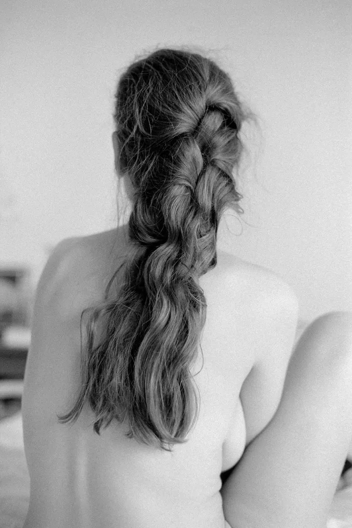 Fanny w/ hair partially untied • Nikon F3, Ilford Delta 400, 50mm f/1.4