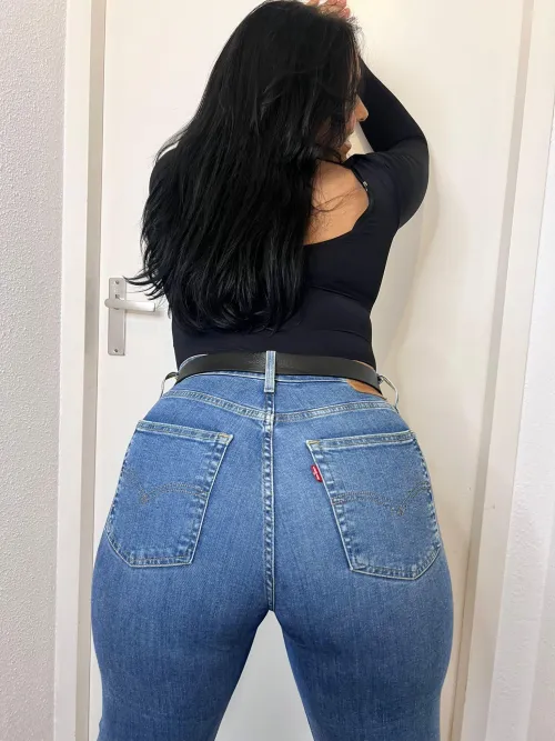 Tanned silhouette in fitted Levis sparking wild heat the shores most captivating allure