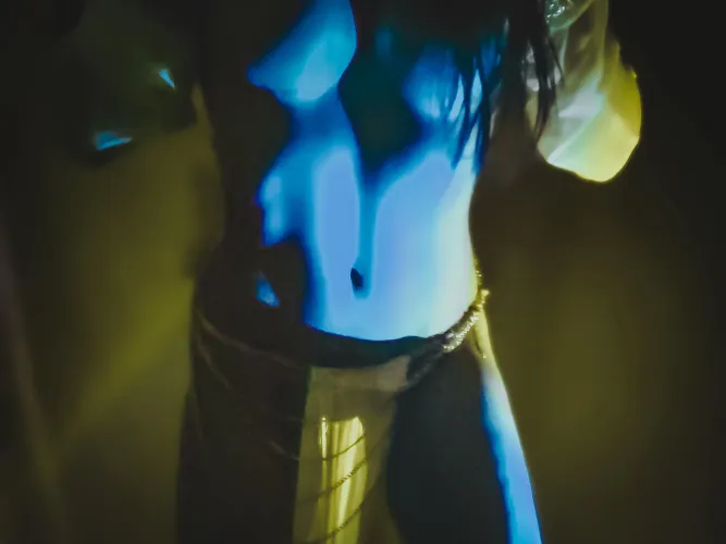 Light bends around her