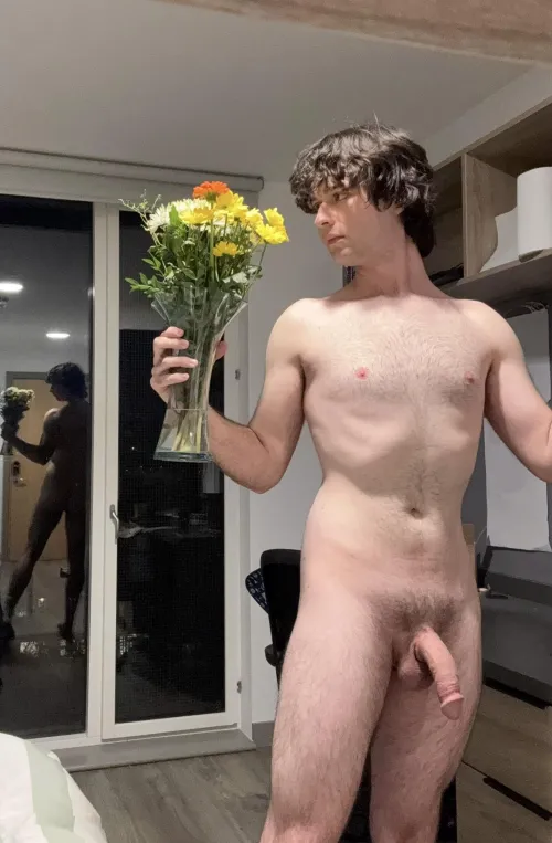 Nude with a vase of flowers