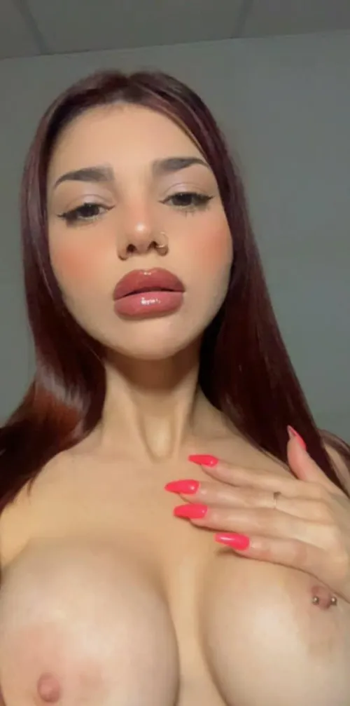 Pale skin stretched so tight you can see the blue veins pulsing.