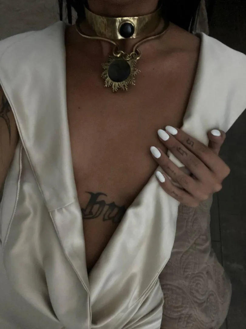 Gold at my throat, secret on my chest. Guess which one you're allowed to touch .