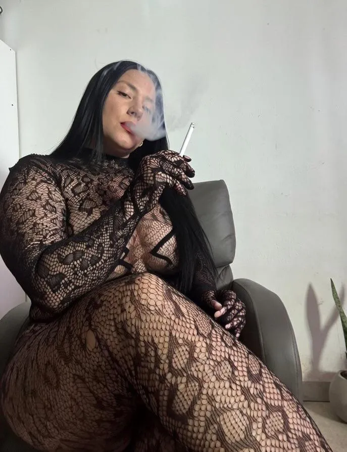 The smoke swirls around my face as I play with the cigarette between my fingers. You watch in silence, completely mesmerized.