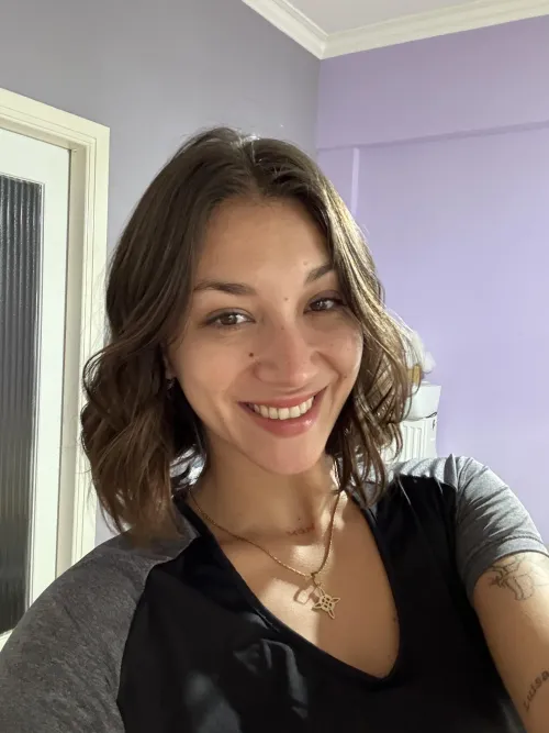 grinning at my phone like when i get a message from you