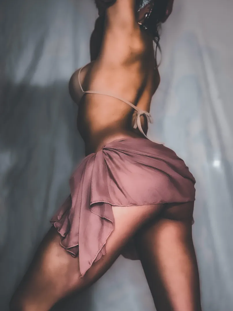 A sheer loincloth-style skirt drapes low, emphasizing hips and motion, just for you