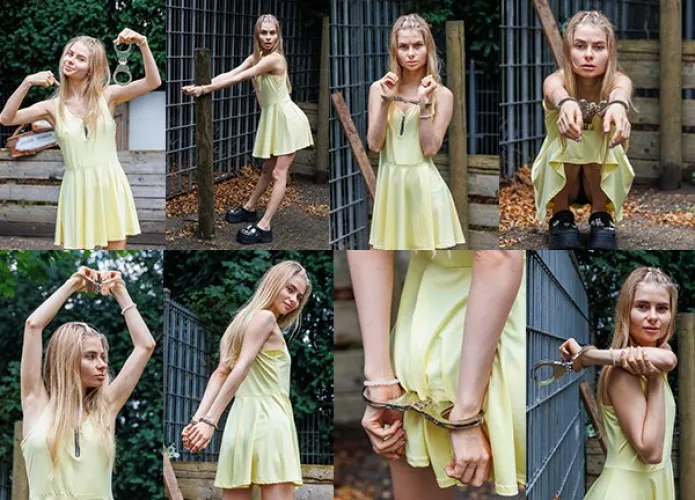 Ksenia cuffed to a metal frame