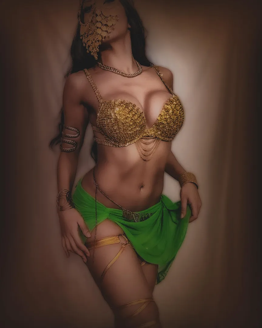 Bare midriff elegance, glowing under warm tones