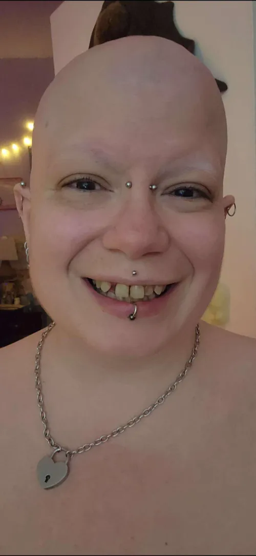 Smiling wide with a freshly shaved head <3