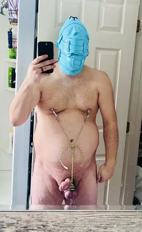 Spent time this morning in some self bondage. I tight my balls to my nipple clamps so that when I moved or laid flat it pulled so tight