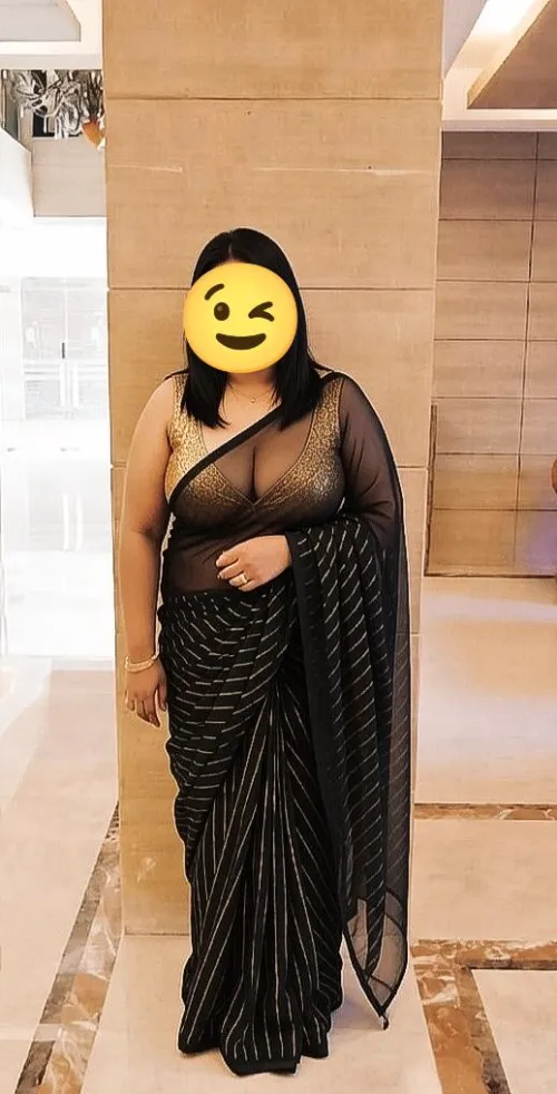 School: pleats tight, blouse sealed — untouchable teacher, zero skin. Weekend: sheer black net clings like sin, deep gold plunge, nipples teasing, body begging to be claimed. Orthodox by weekday… shameless flaunt by the weekend . Forbidden to fuckabl