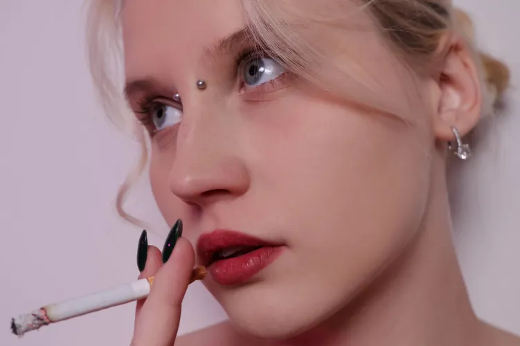 Feel this moment, as I hold a strong cigarette