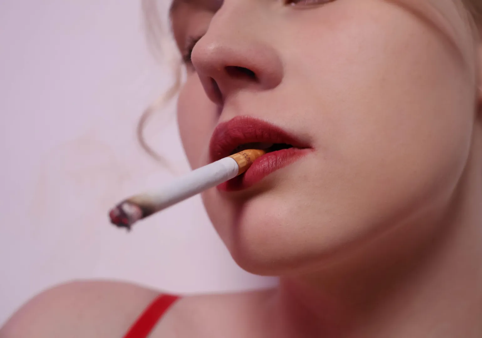 The smoke drifts into my lungs, making me happy