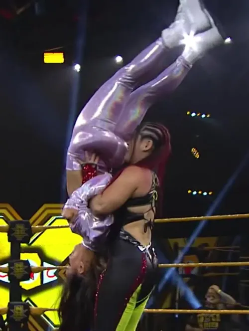 Lo Shairi/Iyo Sky performing a move with Aliyah's fat ass in her face