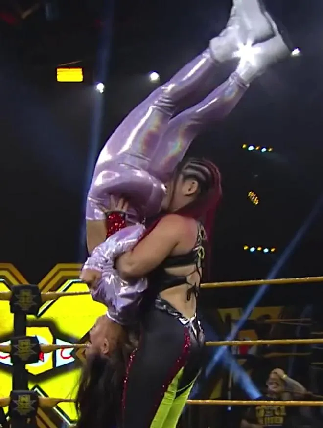Lo Shairi/Iyo Sky performing a move with Aliyah's fat ass in her face