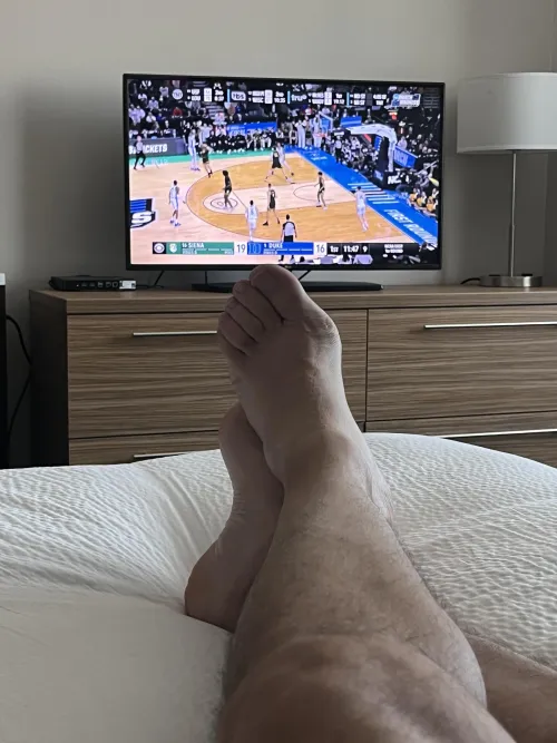 Dad (47) relaxing in my hotel room before my conference starts, and enjoying the start to the NCAA tourney. Would be extra nice if someone was rubbing my feet right now.