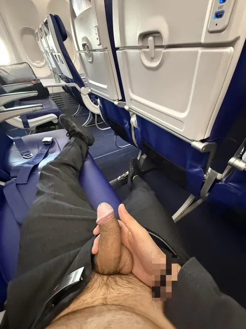 Delayed flight with few people on board means to take that risky pic