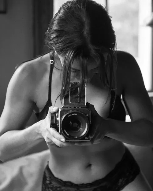 These days I only use it as a prop, but back in the day this was my main camera. Black Lingerie and Hasselblad 500c/m.