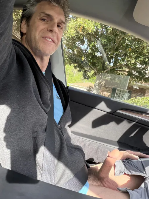 In the car with cock on display