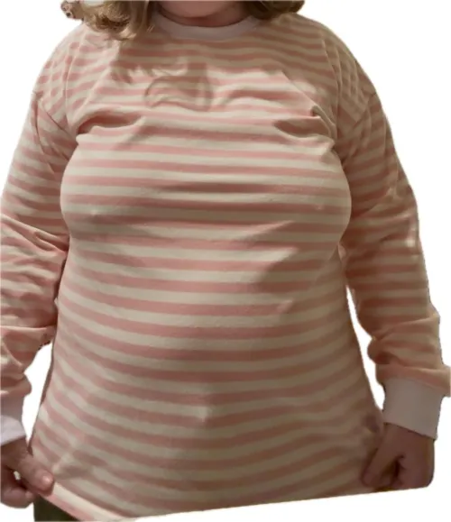 Stretched to the limit in my cozy top… who wants to rip it off?