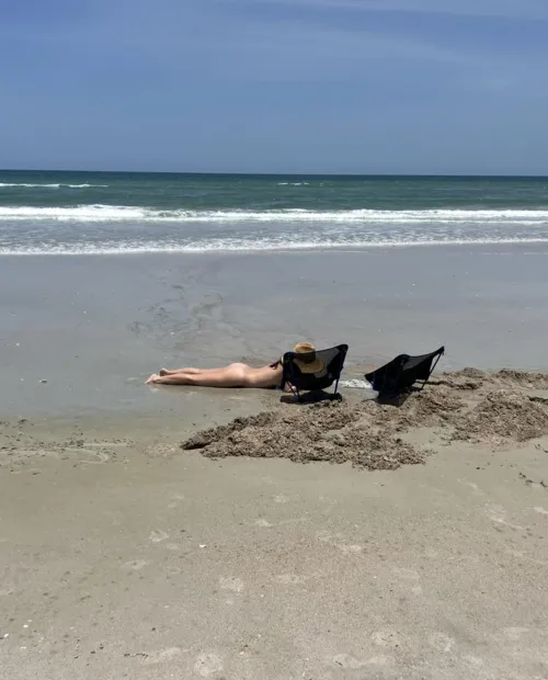 Nude beach sand castle building is the best way.