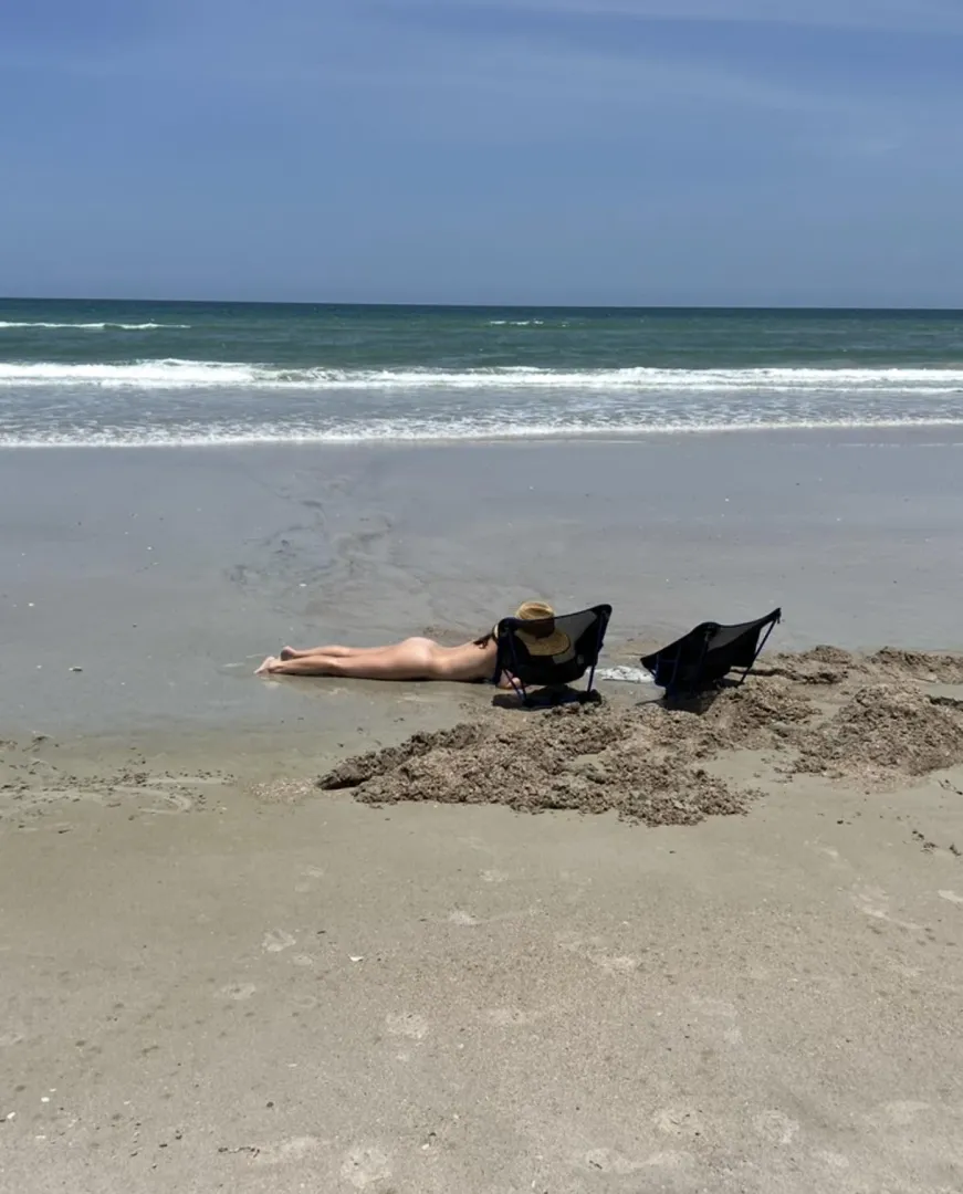 Nude beach sand castle building is the best way.