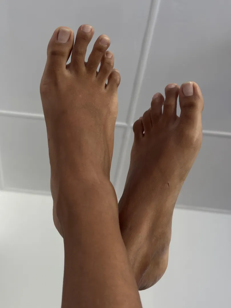 Feet up in the air, dildo in my pussy