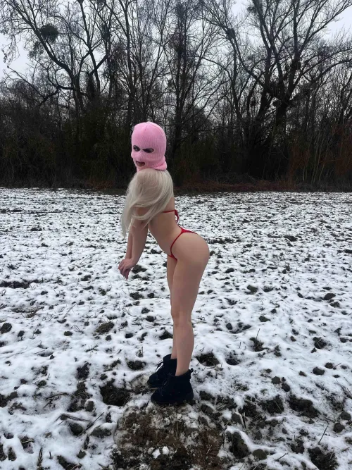 Snow, boots, red bikini and the usual pink mask, what do you need more than that?