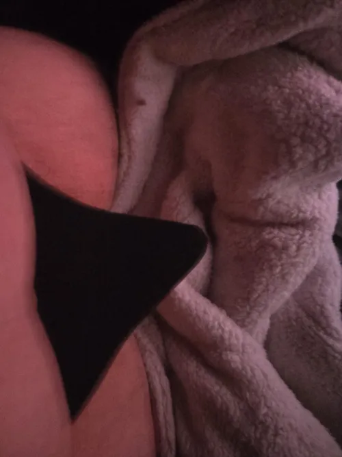 (30) snuck a pic in bed with my partner to show off my tent in my thong helping my little cock look slightly bigger I think 