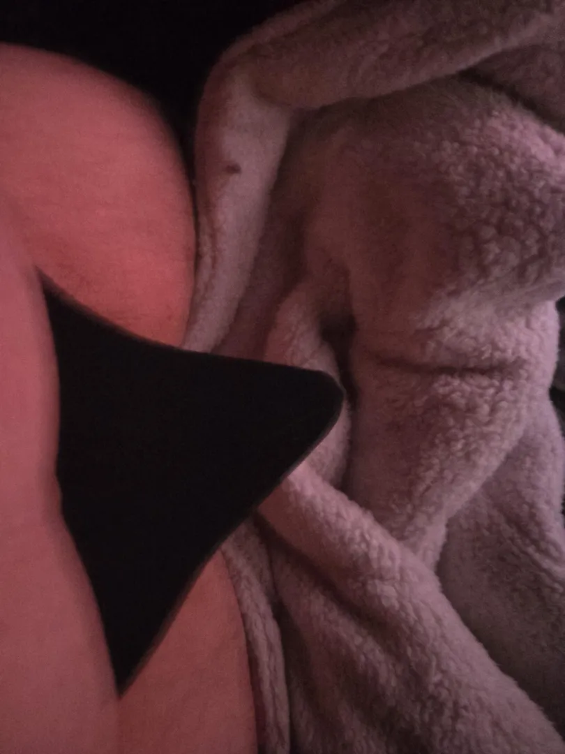 (30) snuck a pic in bed with my partner to show off my tent in my thong helping my little cock look slightly bigger I think 