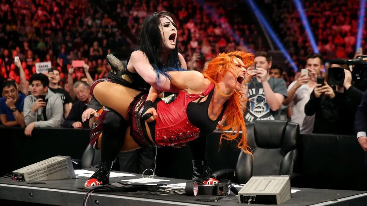 Paige tortures Becky with a PTO
