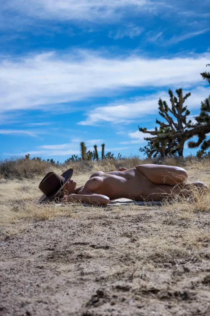 Sunbathing in the buff under that big blue tease