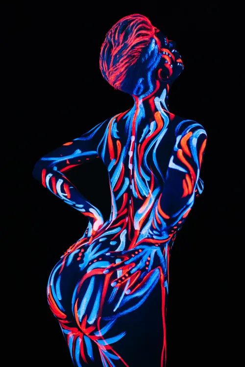 Fluorescent bodypaint under UV light