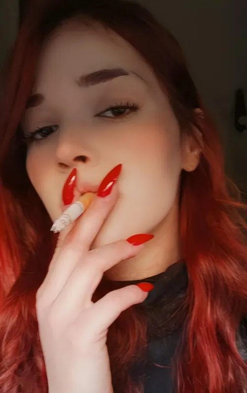 Red nails and a lot of smoke
