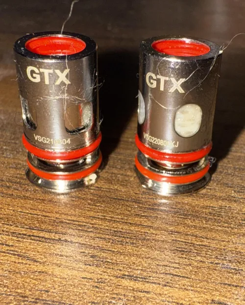 Can anyone tell me why these GTX .2 mesh coils have two different designs??? Help!