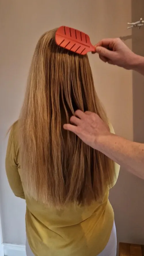 Having my hair brushed