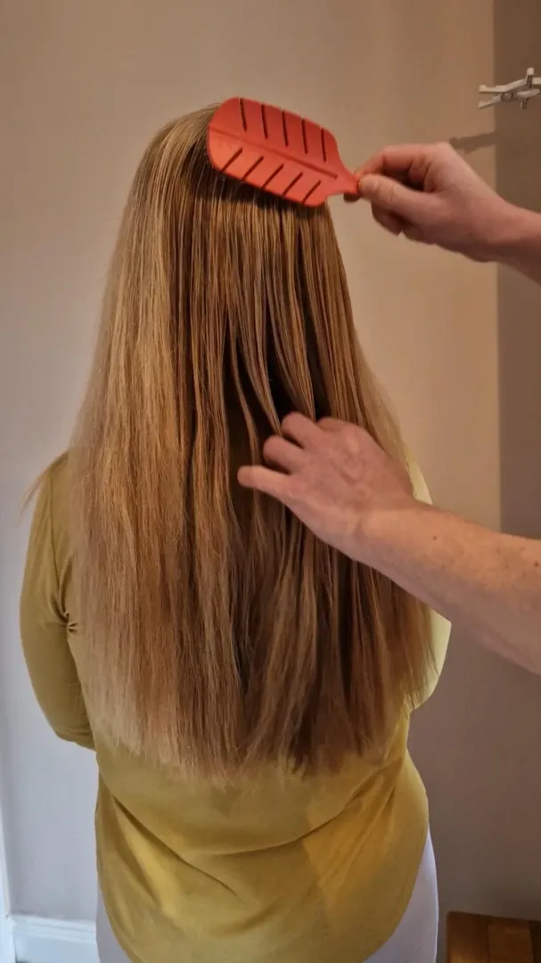 Having my hair brushed