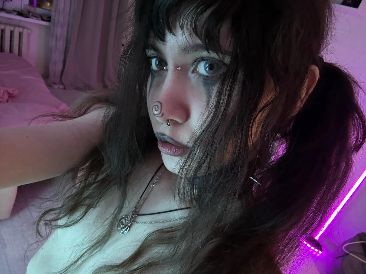 heavy makeup metal babe with piercings