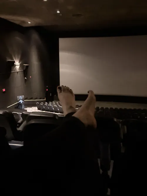 Feet out at the movie theatre… would I distract you?