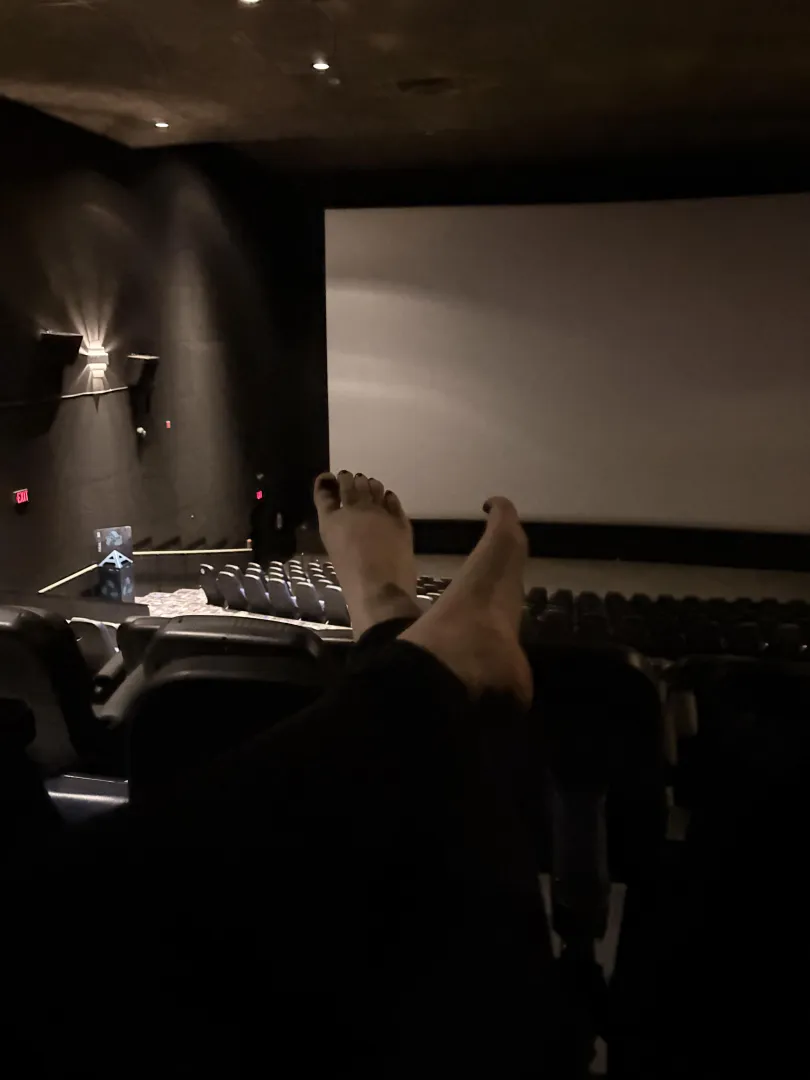 Feet out at the movie theatre… would I distract you?