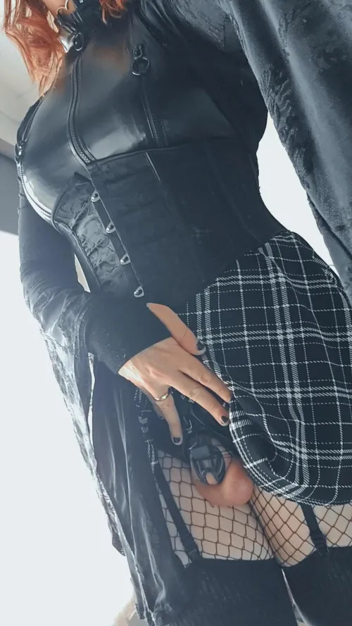 Wouldnt expect to find a little cage hiding underneath that goth chicks dress would you