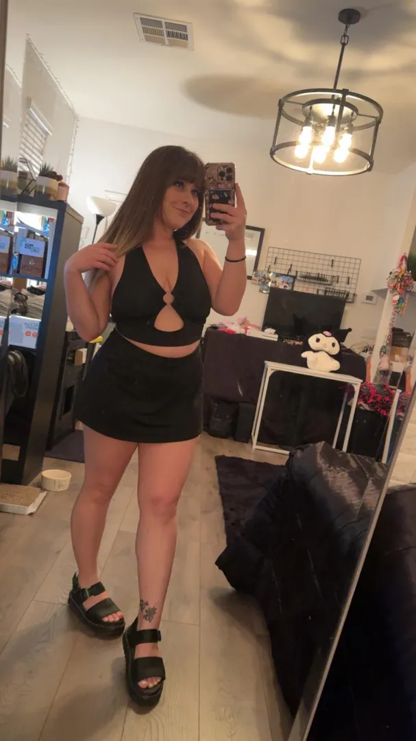 No bra with my low-cut top and little black skirt 