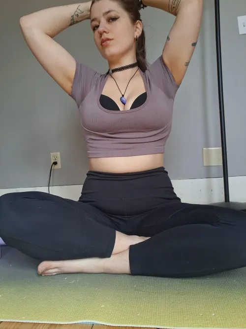 Scoop neck crop top with a black bra on top