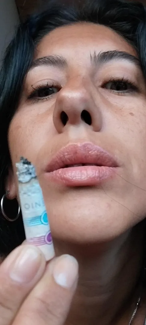 Two temptations together, my full Latina lips and my cigarette, there goes the ash to your mouth