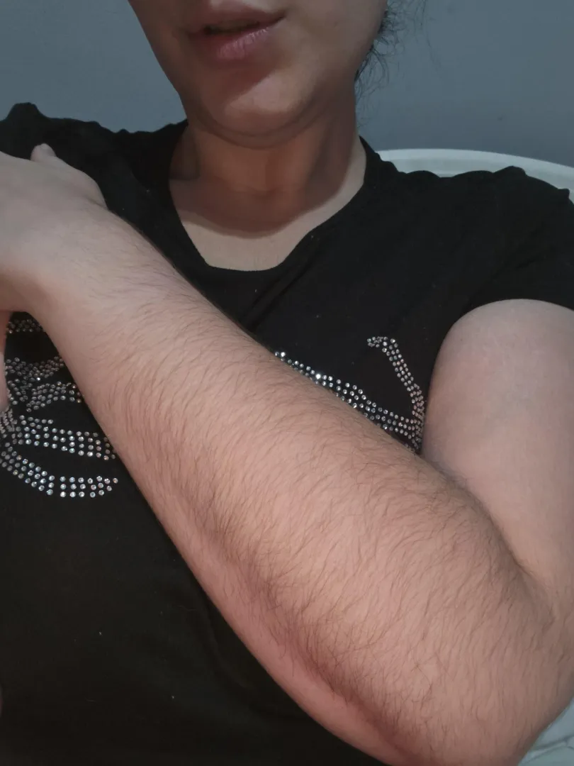 My naturally hairy and well-groomed [arms]